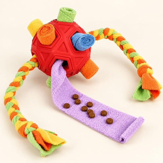 Paws Snuffle Ball with colorful fleece rolls, braided tails, and dog treats on an unrolled purple strip